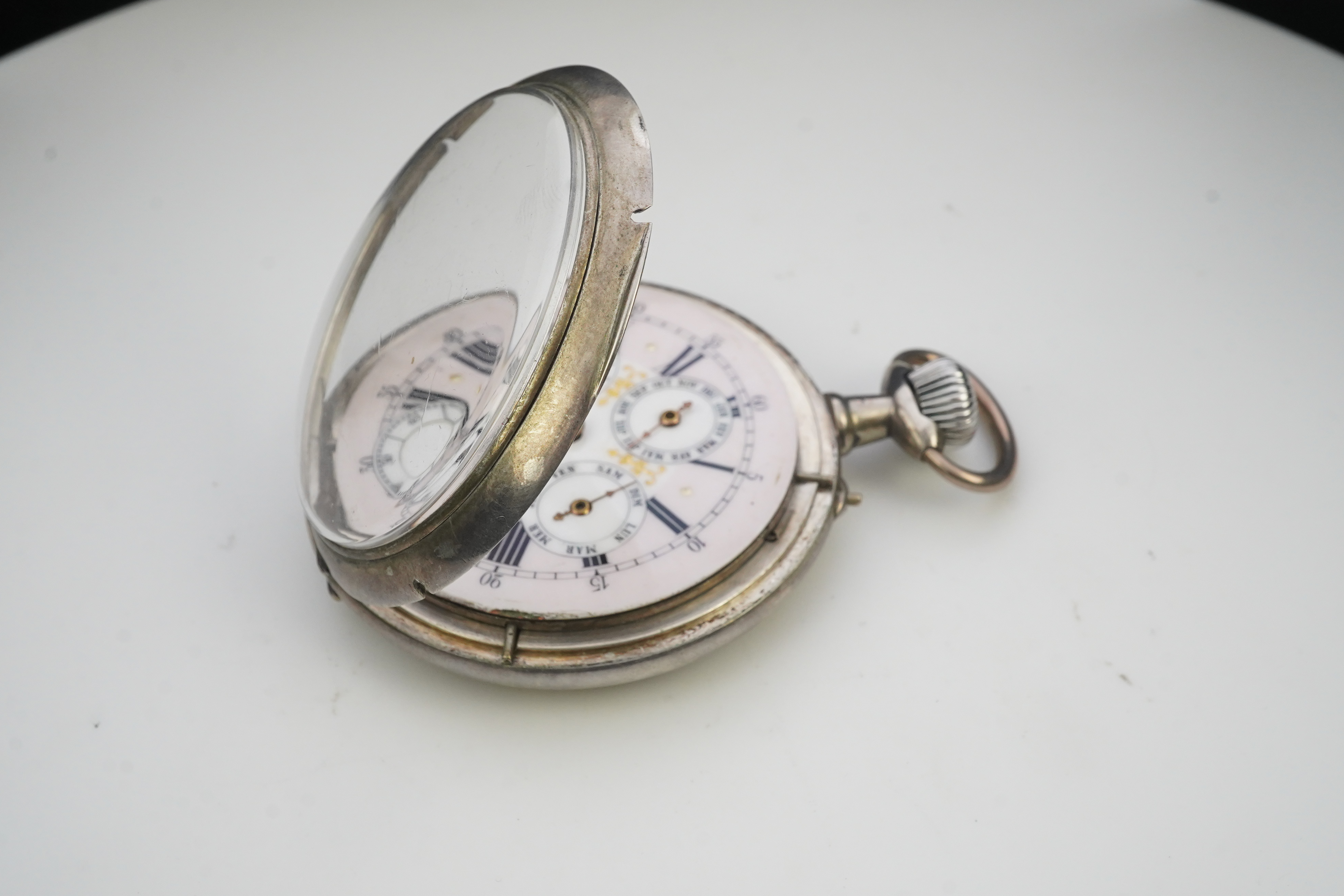 A large early 20th century German 800 standard silver open faced calendar moon phase keyless pocket watch